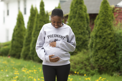 Pregnant black woman in a white T-Shirt