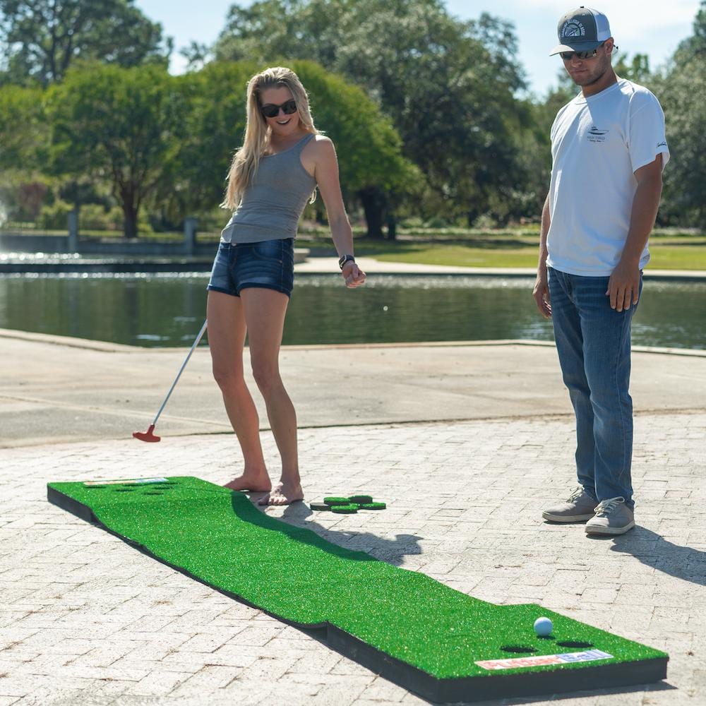 Adults having fun playing outdoor golf game