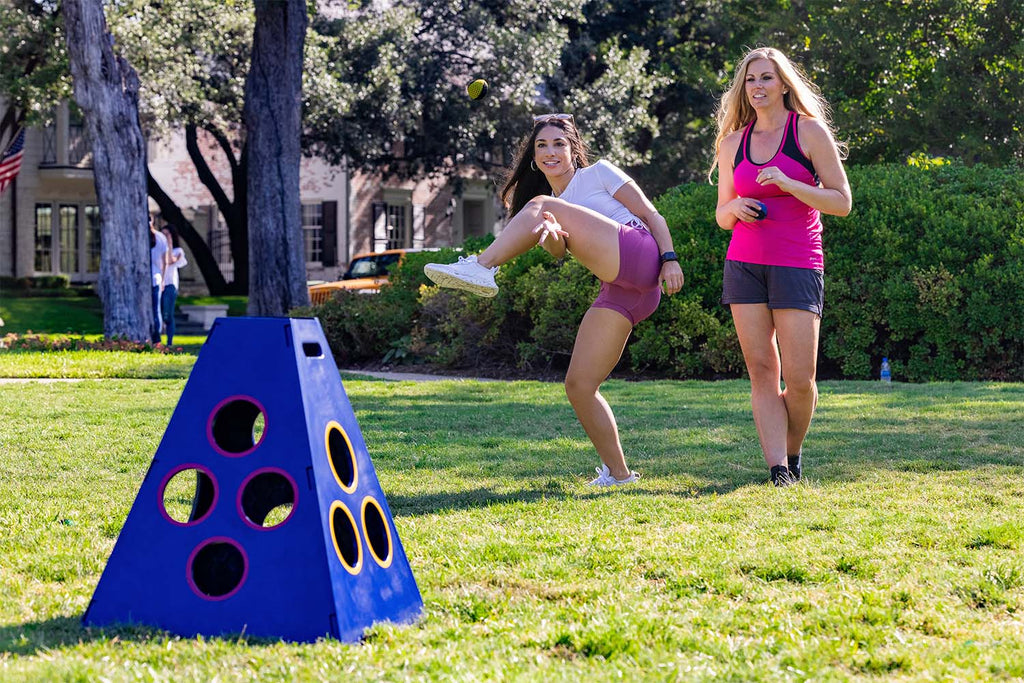 Women in the backyard playing TowerBall