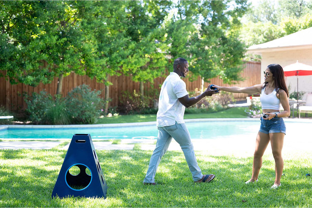 Backyard games for families Playing TowerBall Next To a Pool