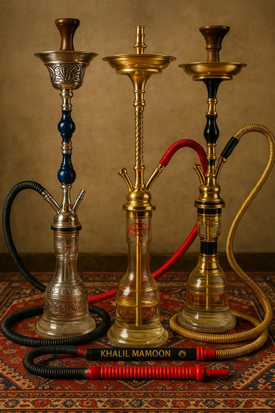Some Khalil Mamoon Hookahs sitting pretty next to each other.