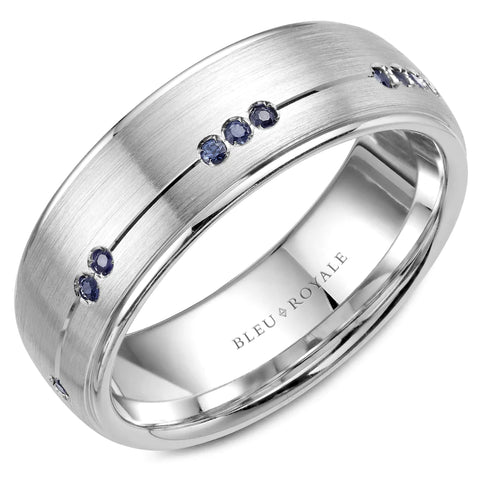 a white gold band set with blue sapphires