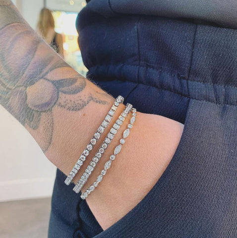 3 diamond tennis bracelets in white gold stacked together