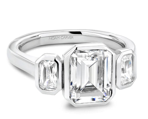 A three stone emerald cut engagement ring