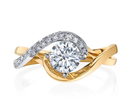 a yellow gold engagment ring with white gold accents holding the small side diamonds