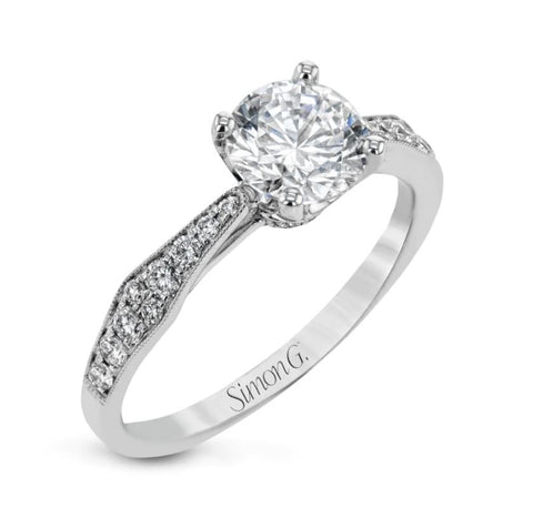 a white gold diamond engagement ring with art deco inspired details
