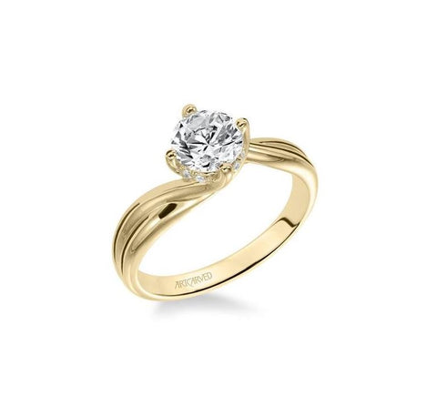 a yellow gold diamon solitaire engagement ring