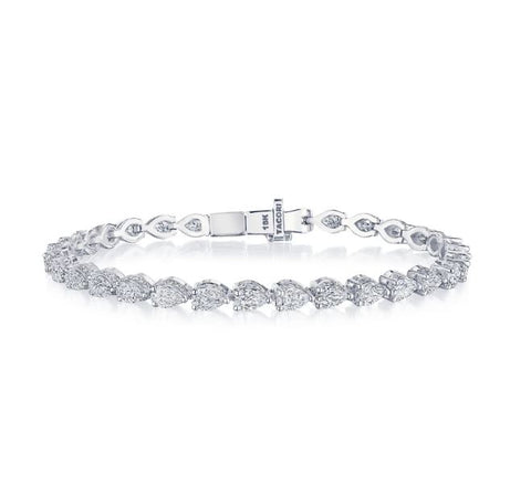 a white gold tennis bracelet made out of pear (or teardrop) shaped diamonds