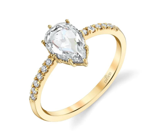 a yellow gold pear cut engagement ring