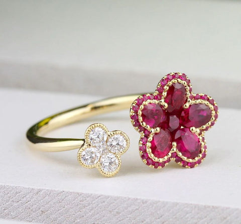 rubies form a floral motif in this yellow gold ring