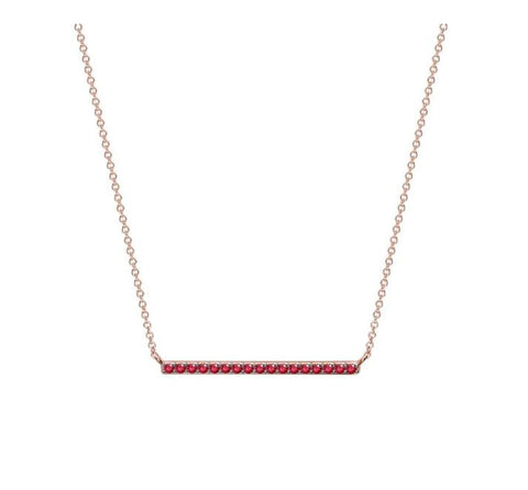 a ruby bar necklace in rose gold