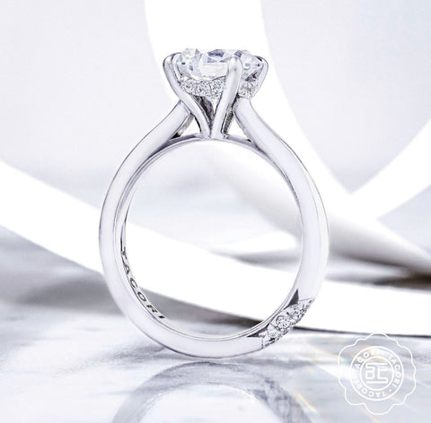 a simple solitaire engagement ring with a hidden halo