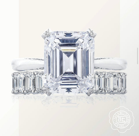 an emerald cut diamond solitaire ring is shown with an emerald cut eternity band