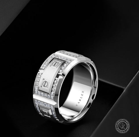 A white gold wedding band for him, wide, set with diamonds and design