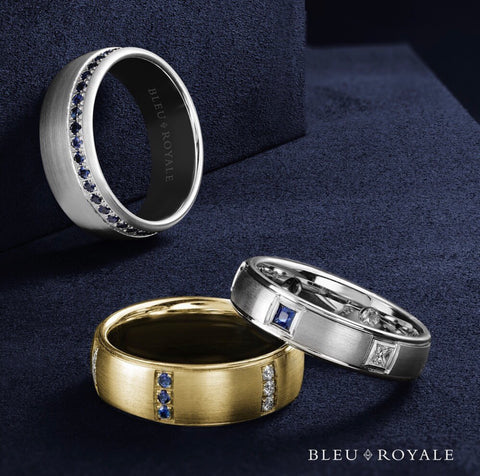 three wedding bands set with diamonds and/or sapphires