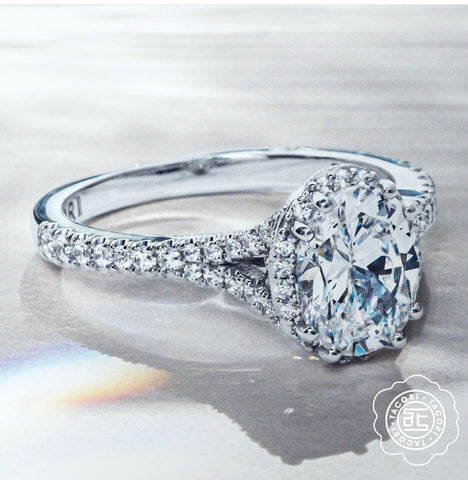an oval halo engagement ring