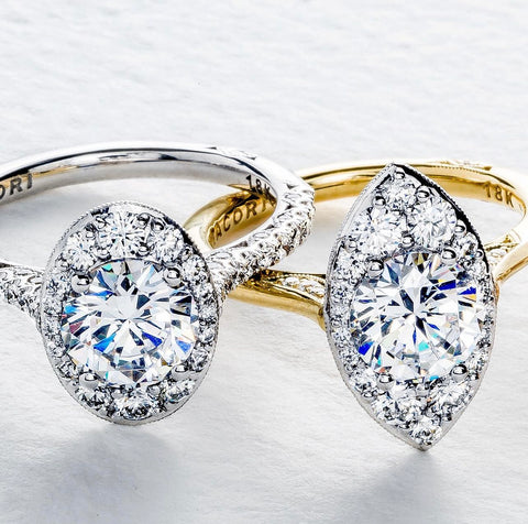 an oval shaped halo ring and a marquise shaped halo ring