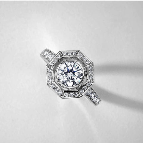 an art deco inspired halo engagement ring