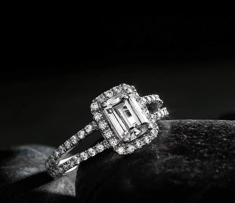 an emerald cut diamond halo engagement ring