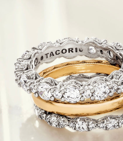 an eternity band with white diamonds is shown with a yellow gold band and a narrow white diamond band