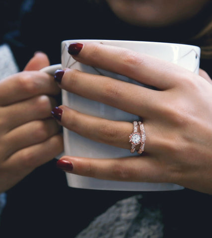 a rose gold floral diamond wedding set