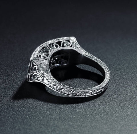 a white gold diamond and sapphire ring