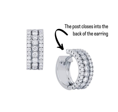 white gold diamond huggie earrings with three rows of diamonds