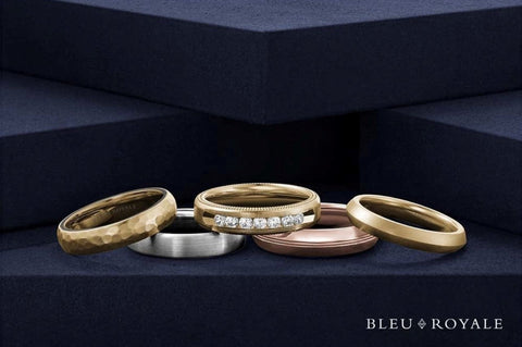 a variety of narrow yellow, white and rose gold mens wedding bands