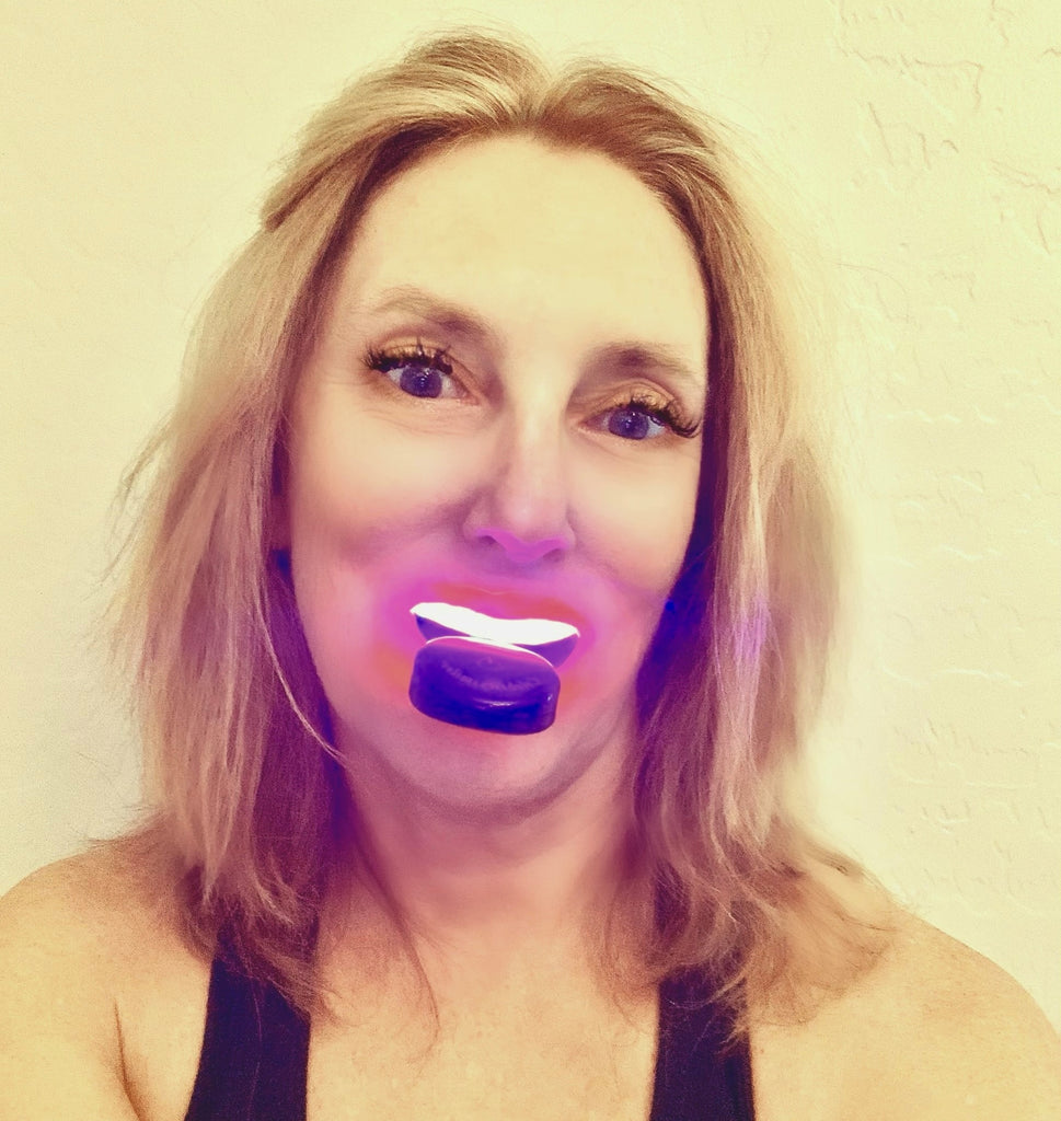 Debbie Bittke whitening her teeth with the Celebrity Smiles Wireless Teeth Whitening Kit