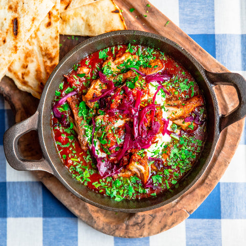 A spicy chicken dish with flat bread at Megan's restaurant