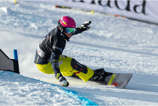 Two sets of skis and poles in snow