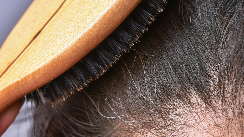 Blogs: Premature White Grey Hair Brunette Lady Brushing Hair