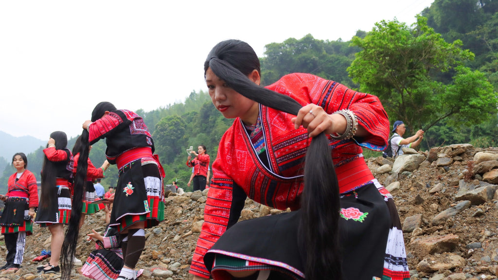 Blog: Red Yao Woman Twisting Hair in Protective Style