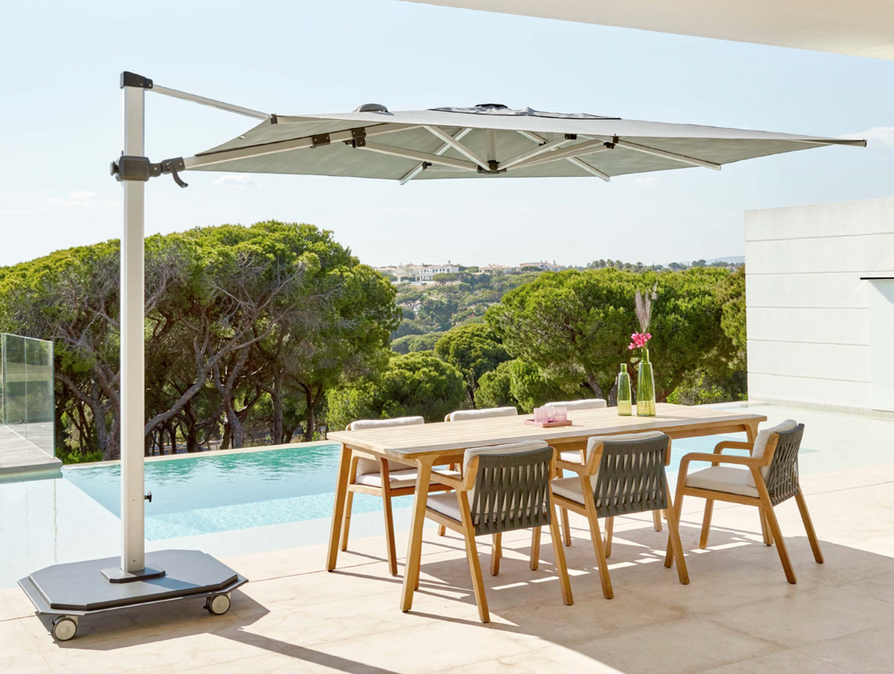 parasols-uk-jcp4-next-to-pool-and-dining-table-1.png