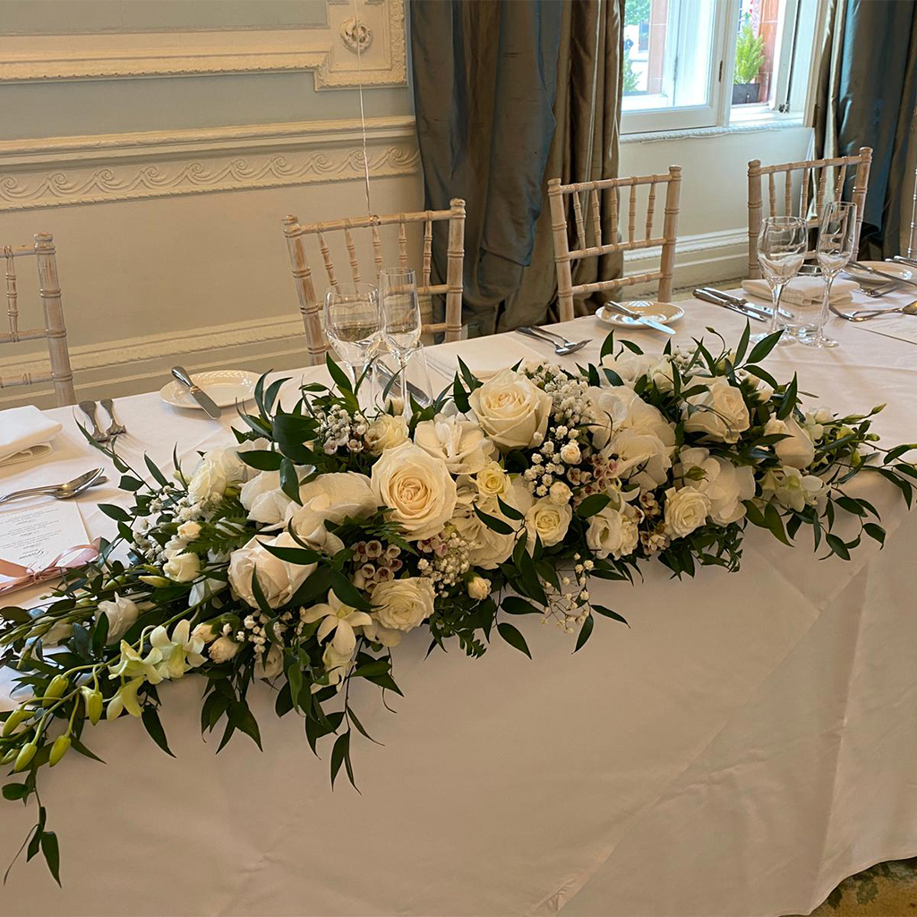 white wedding flowers on table