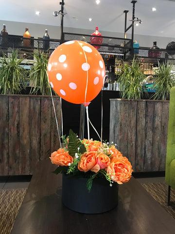 Orange balloon in flowers box