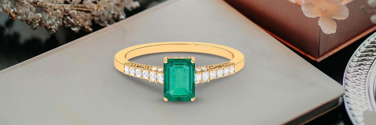 Emerald Solitaire Engagement Ring With Diamond Side Stones