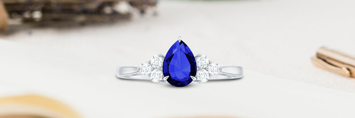 Lab Grown Sapphire Pear Engagement Ring with Diamond Trio