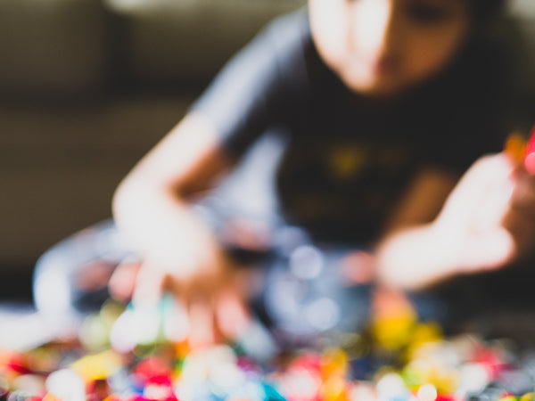 child playing with legos