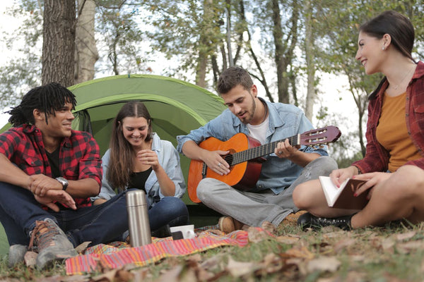 Friends Camping Playing guitar