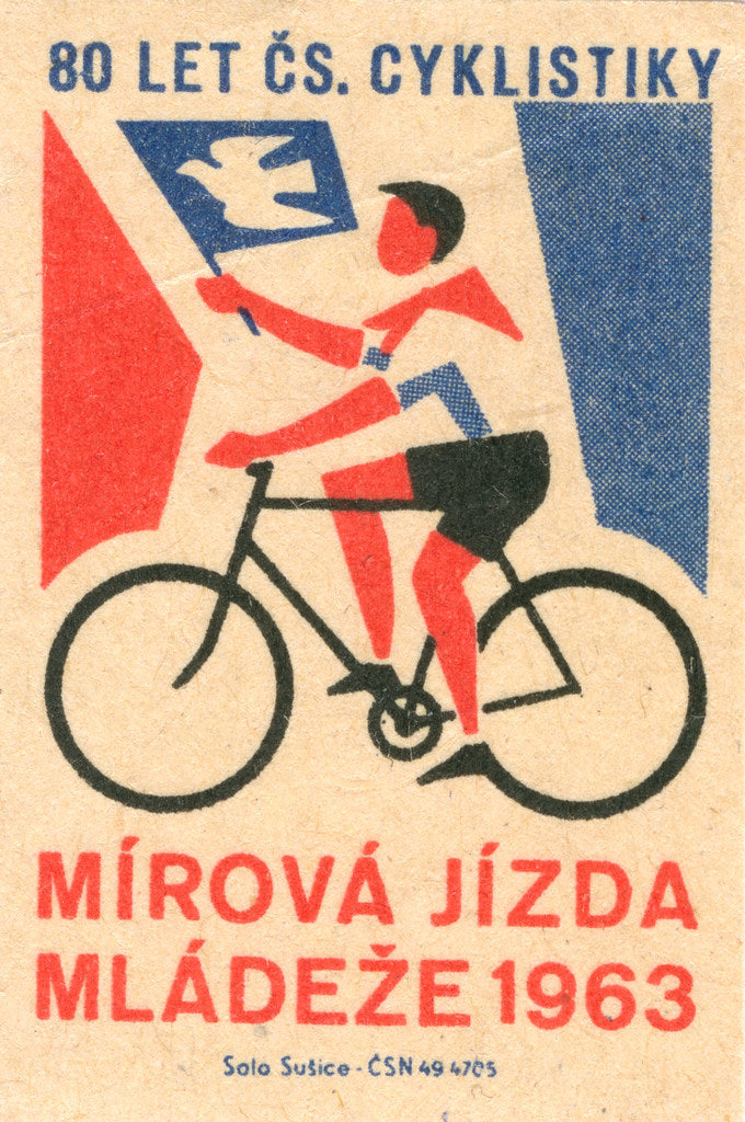 1963 boy cycling with a flag