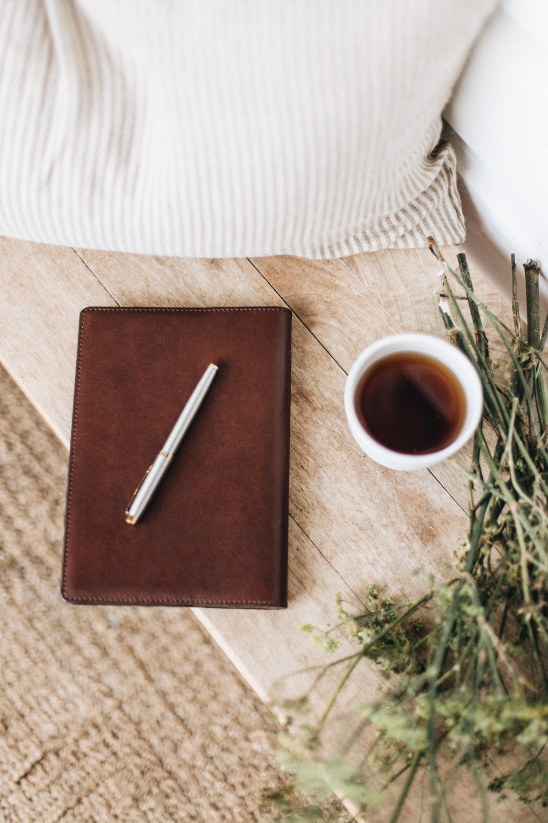 Saddler & Co leather clutch and a cup of tea