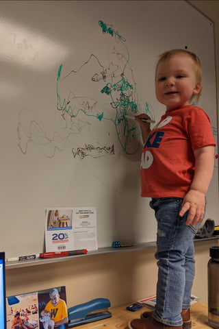 Writing on Dad's whiteboard