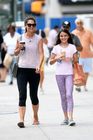 Katie Holmes wearing classic flip flops on street