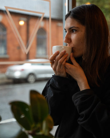 Coffee roaster Valeriia having coffee