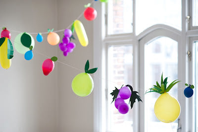 Party Decoration ideas using balloons to form fruits or the shapes of other items.