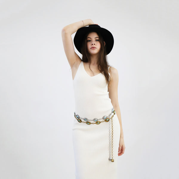 Model wearing Mini Oval Turquoise Concho Chain Belt in white dress