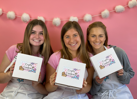 Kate, Madeleine, and Gabrielle holding their kit & sis craft boxes created for American Girl dolls