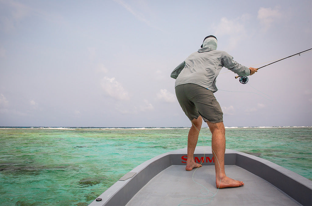 Making a shot to a cruising permit on the flats of Belize.