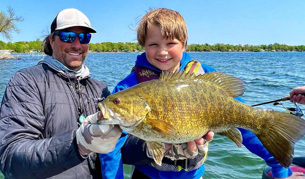 Ronnestrand and son with a big smallie caught on a finesse marabou jig